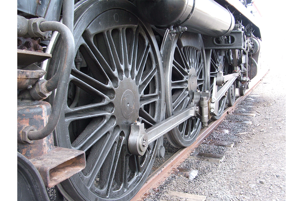 Close up of the drivers wheel of a steam train.