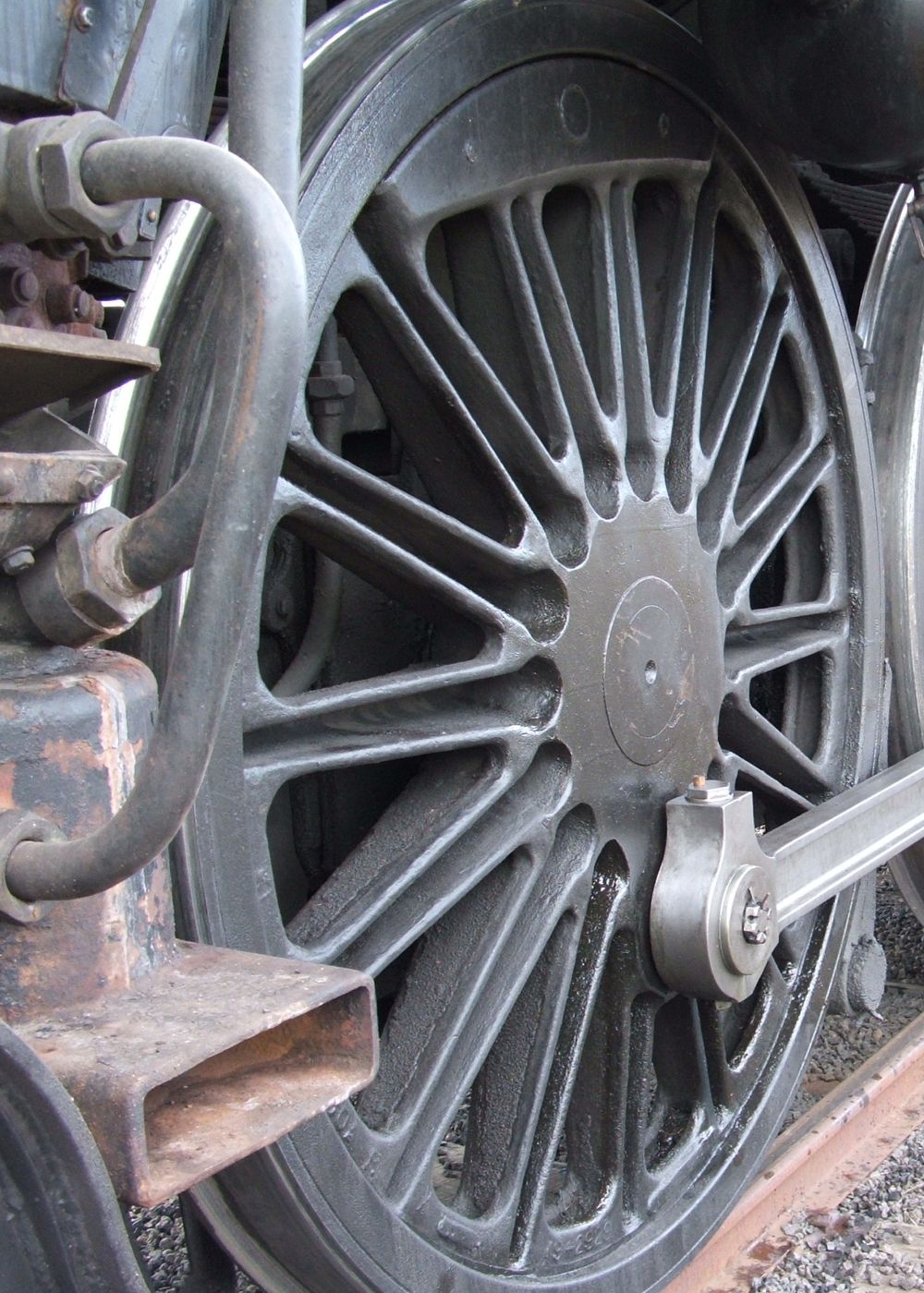 Close up of the drivers wheel of a steam train.