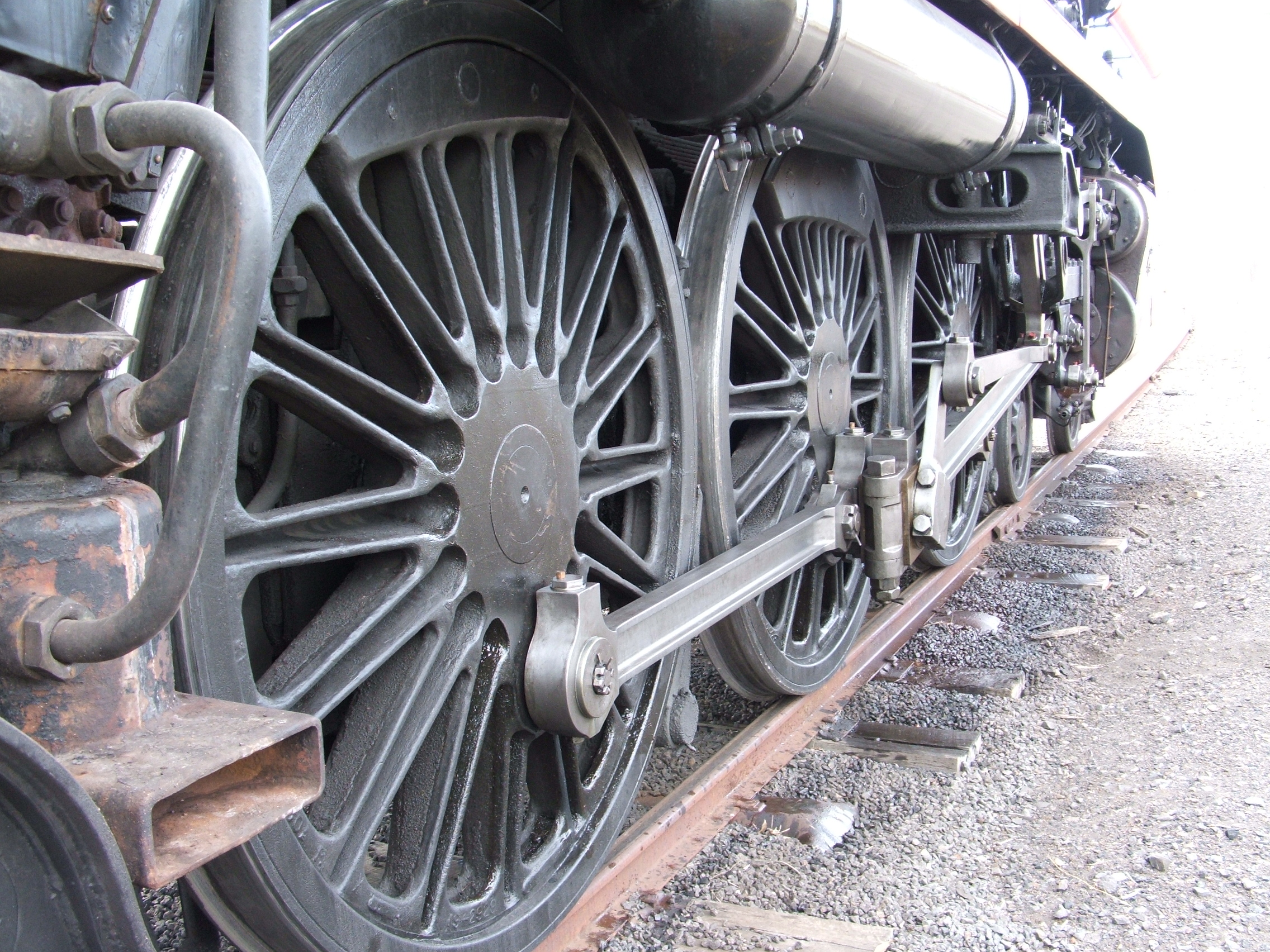 Close up of the drivers wheel of a steam train.