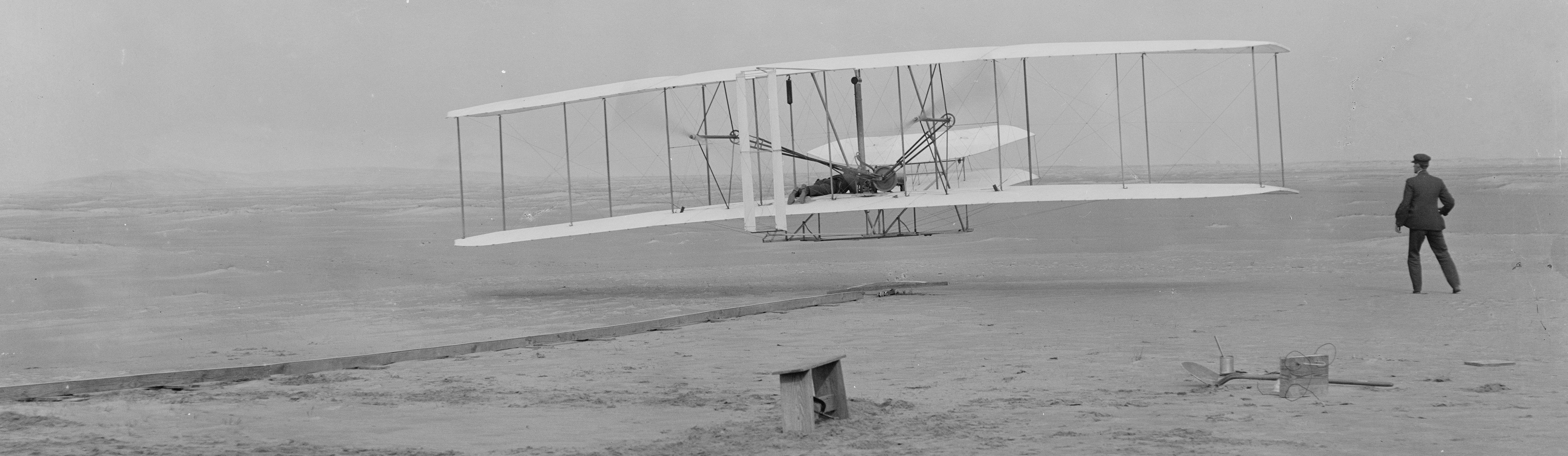 Person watching the Wright Flyer take off.